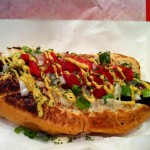 Our kielbasa sausage generously topped tomatoes, green onions, and mustard.